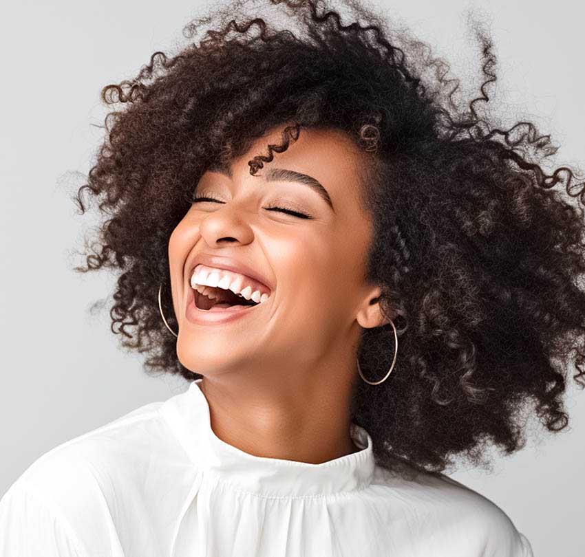Woman with curly hair laughing